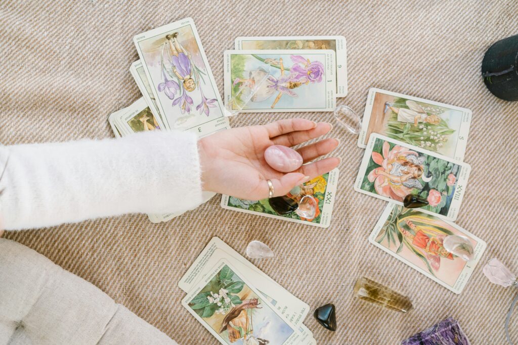 pexels-photo-6944906-6944906 A serene setup of tarot cards and crystals invites insight and introspection.